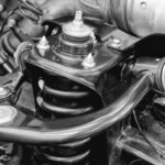 MacPherson Strut vs Double Wishbone Suspension: Which Is Better?